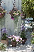 Terrace with homemade flower baskets and willow pots