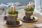Christmas table decoration, golden candles in pots