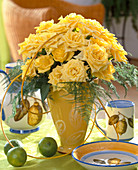 Bouquet with yellow roses and asparagus (protoasparagus)