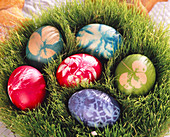 Dyed easter eggs in the wheat nest