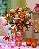 Tulipa, mixed tulip bouquet in orange-white vase