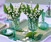 Convallaria majalis (Lily of the valley) in wine glasses