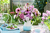 Cottage garden bouquet in jug: Phlox, Echinacea