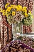 Vase of hydrangeas and false sunflowers