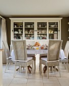 Rattan chairs around set dining table