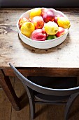 Bowl of fruit on rustic wooden table