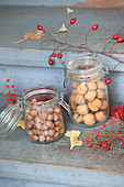 Walnuts and hazelnuts in mason jars