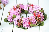 Luxuriant wreath of hydrangeas, berries and leaves