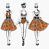 Three fashion models side by side approaching camera wearing plaid