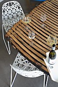 Delicate chairs at dining table made from barrel staves