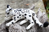 White, hand-made, felted, woollen leopard