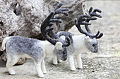 Two hand-made, felted, woollen reindeer