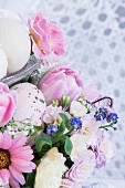 Easter flower arrangement with speckled egg