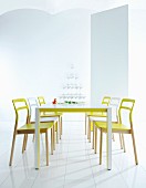 Modern dining area with neon furniture and pyramid of glasses