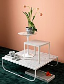 Arrangement of various tables and objects made from white marble and tulips