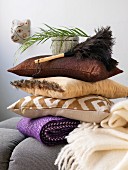 Stacked pillows and feather duster