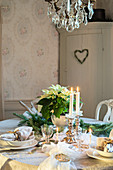 Table festively set in shades of silver and cream