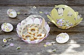Pastel paper baskets and Easter eggs decorated with paper flowers