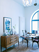 Arched window and Scandinavian designer furniture in living room