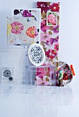 Plexiglas designer chair and floral fabric artworks