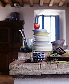 Plates stacked on rustic kitchen counter
