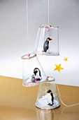 Festive pendants with penguin figurines