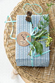 Christmas present decorated with twigs and gift tag