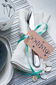 Linen napkin, cutlery and name tag