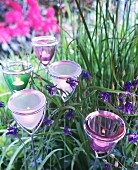 Decorative garden stakes with glass tealight holders on top