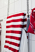 Stripe towels hung from DIY towel rail