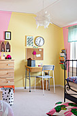 Wall painted yellow and pink in child's bedroom