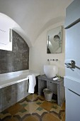 Bathroom with vaulted ceiling in restored period building