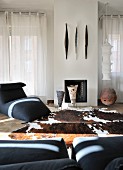 Ceramics and animal-skin rug in elegant living area with ethnic ambiance