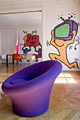 Round purple easy chair in front of pop-art murals on walls