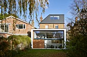 Traditional brick house with modern extension and garden