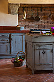 Distressed, blue wooden units in Mediterranean country-house kitchen
