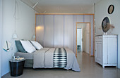 Translucent lightweight partition in grey and white bedroom
