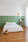 Two-tone painted wall in simple bedroom