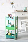 Serving trolley hand-made from fruit crates and painted in shades of green