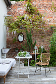 Inviting seating area on terrace with exposed brick wall