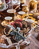 Christmas pomanders made from cloves and ribbons on coffee table