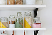 Hand-painted storage jars on shelf