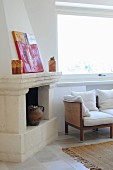 Traditional open fireplace decorated with ceramics and artworks