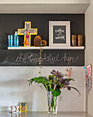 Chalkboard wall with shelf and various accessories