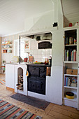 Old, wood-fired kitchen stove in Scandinavian country-house kitchen