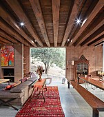 Ethnic-style living room with striking ceiling structure