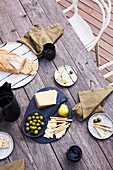 Laid wooden table with Mediterranean snack