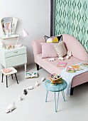 Retro ambiance, pastel shades, soft toys and picture books in child's bedroom