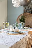 Christmas table set in cool winter colours and gold
