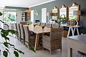 Long table and wicker chairs in dining area